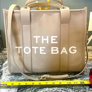 The Tote Bag Great Quality Heavy Duty. Looks great for everyday or for work!